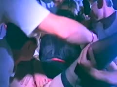 A number of guys gang team-fuck a horny brunette whore wearing a mask.
